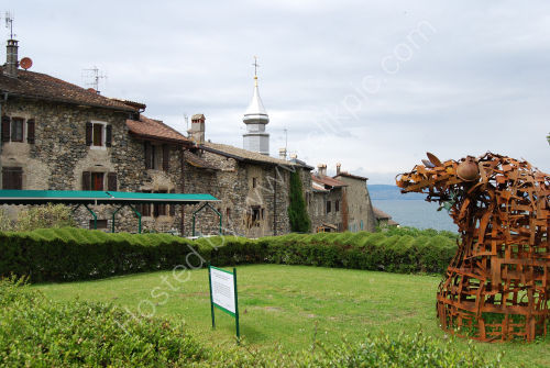 Medieval buildings and modern sculpture