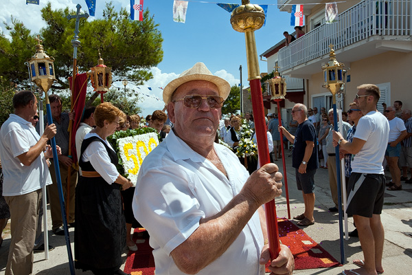 Pilgrims and helpers of Our Lady of the snow procession in Kukljica, island Ugljan, Croatia