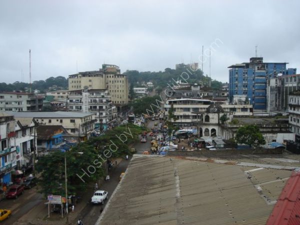 Abandoned Ducor Intercontinental Hotel on hill in background, Monrovia, Liberia