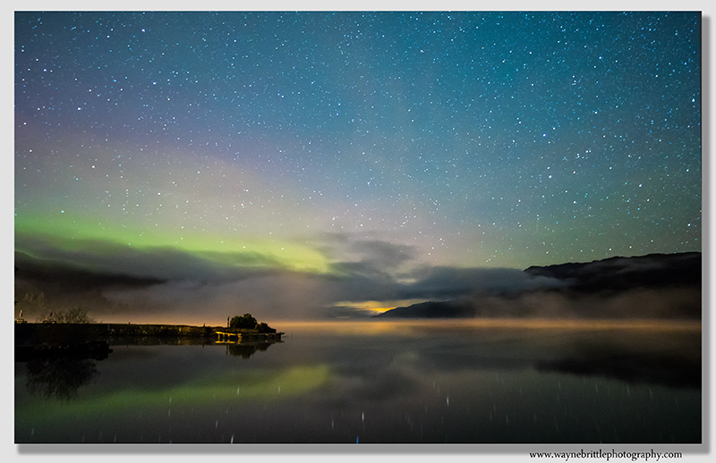 Aurora and the night sky over Loch Ness