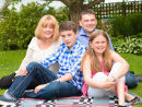 Three generations of family brave the showers for a portrait
