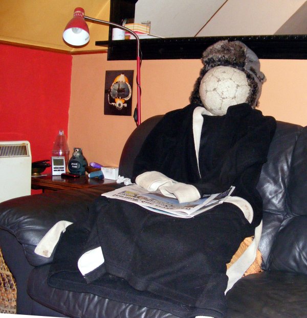 Chris watches football, legless after a day off in Ellon