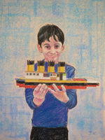 Jackson with lego model of the Titanic. Portrait of Jackson