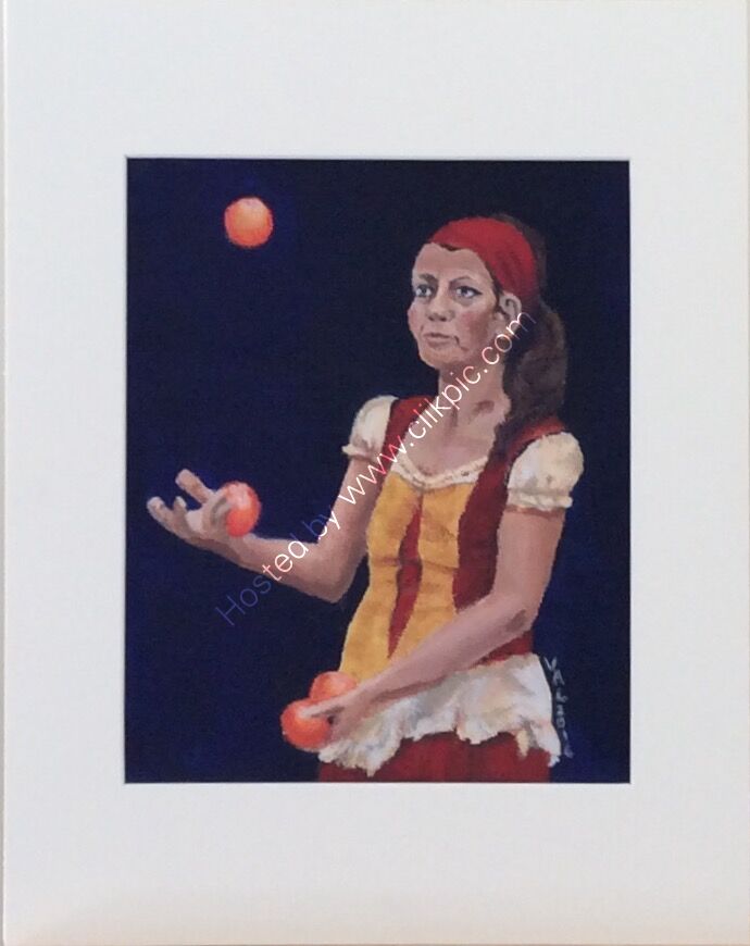 A woman in medieval costume juggling oranges at A Coruna, Spain, framed