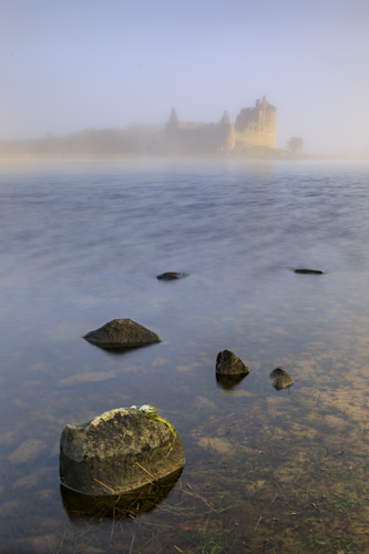 SUNLIGHT ON KILCHURN CASTLE