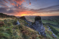 SUNRISE BEHIND ROCKS ON HEN CLOUD