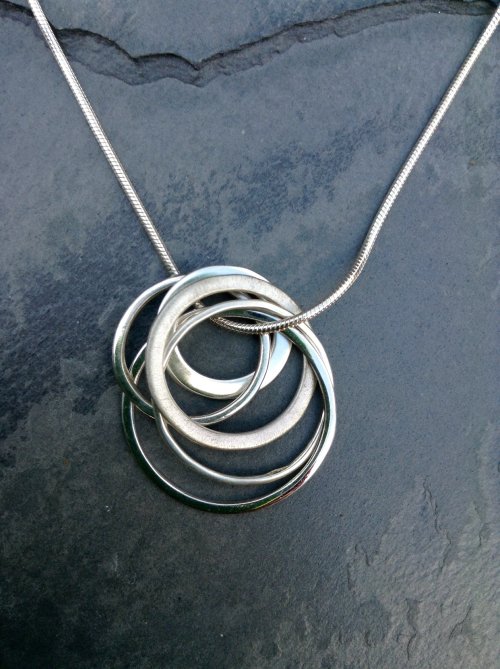 Five ring silver pendant £55