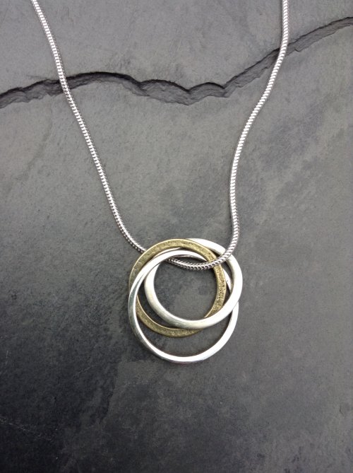 Silver and brass rings pendant £40
