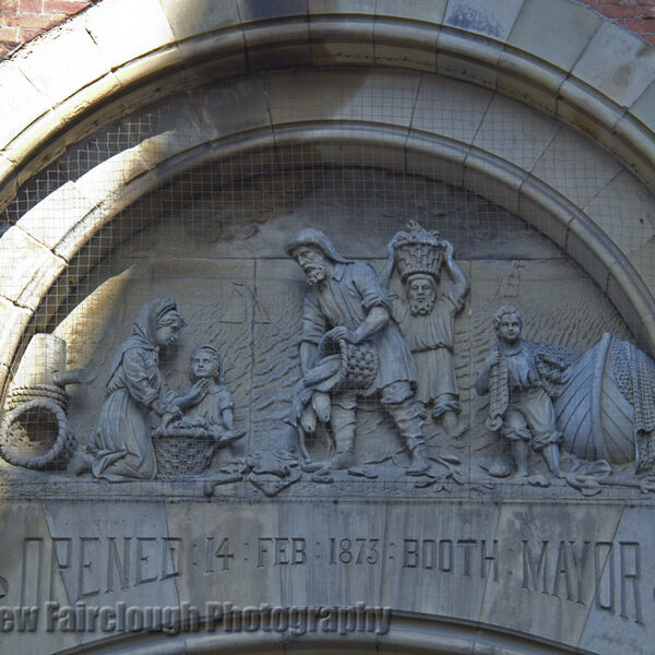 The Story of Fishing captured in the Stone relief on the preserved façade of the former Smithfield Wholesale Fish Market, Northern Quarter, Manchester.