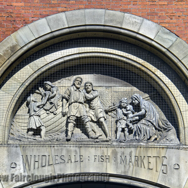 The Story of Fishing captured in the Stone relief on the preserved façade of the former Smithfield Wholesale Fish Market, Northern Quarter, Manchester.