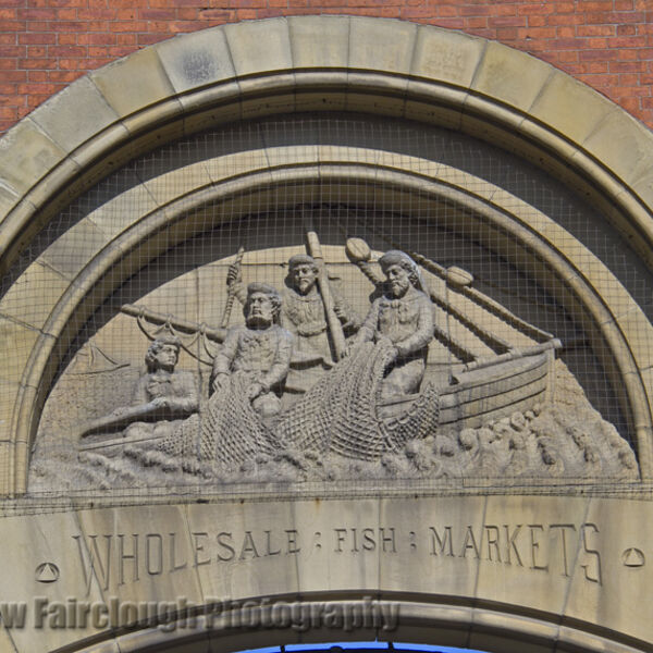 The Story of Fishing captured in the Stone relief on the preserved façade of the former Smithfield Wholesale Fish Market, Northern Quarter, Manchester.