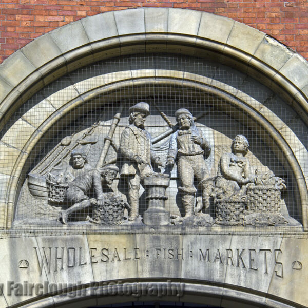 The Story of Fishing captured in the Stone relief on the preserved façade of the former Smithfield Wholesale Fish Market, Northern Quarter, Manchester.