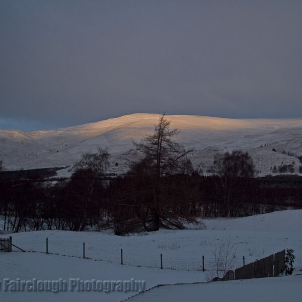 Sunrise on the mountains near Loch Alvie