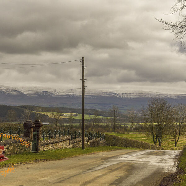 Panoramic View with the Snow-Capped Fells of The Lake District National Park in the Background.