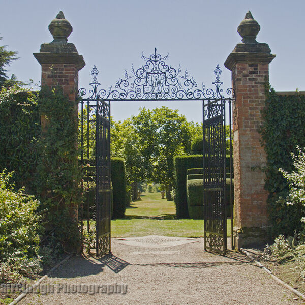 Formal garden with wrought iron gates leading to the Ilex Avenue