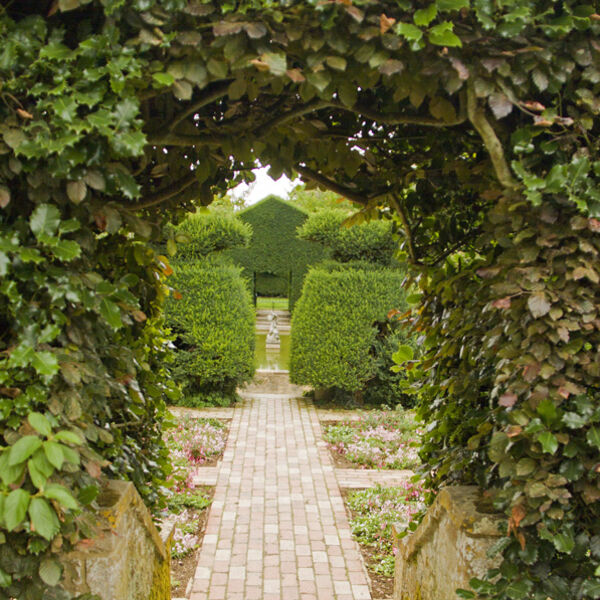 View through the Fuchsia garden to the bathing pool - Hidcote