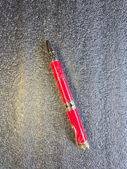 Twist Pen = Red acrylic with black lines on gold