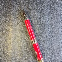 Twist Pen = Red acrylic with black lines on gold