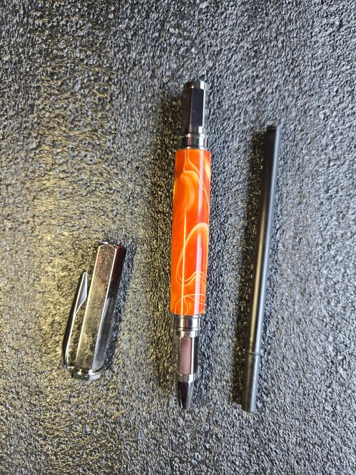 Rollerball Pen = Molten copper on gunmetal