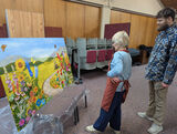 Members looking at painting