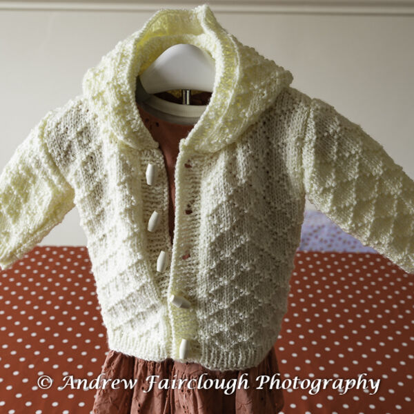 Diamond Design Hooded Jacket in Cream Shimmer yarn.