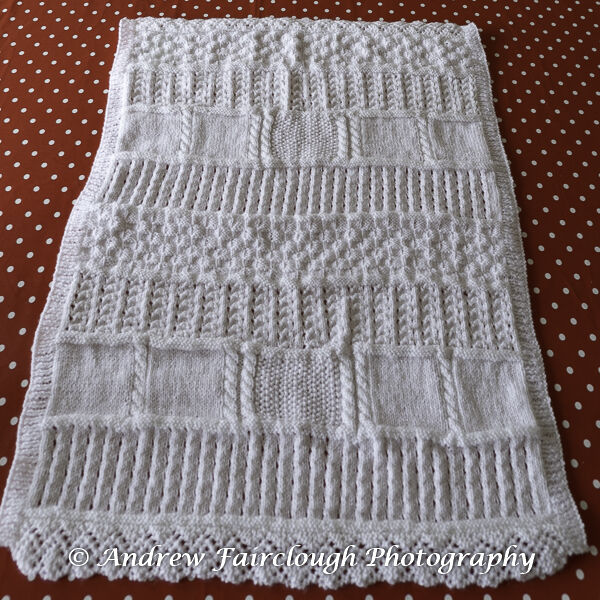 White Shimmer Baby Blanket with two edges ribbed and two edges lace.