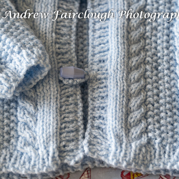 Cable and Moss Stitch Hooded Jacket Detail - Blue.