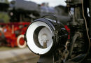 Headlamp on a preserved steam locomotive at railway museum.