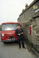 Postman collecting from village post office in the late 70's