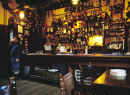 Inside the George Inn, Norton St. Philip at Christmas-time in the 80s.