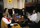 Group of people enjoying a relaxing evening in a country Pub, Wiltshire, UK. ca 1990.