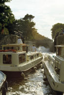 Boats in locks on the Canal du Midi, France.