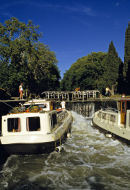 Boats in locks on the Canal du Midi, France.