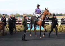 Blue Stello is led into the winners enclosure