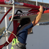 Man carrying windsurf board, Cascais