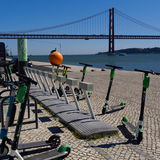 Electric scooters with bridge, Lisbon