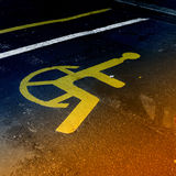Yellow wheelchair parking space