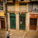Man reading newspaper, Porto