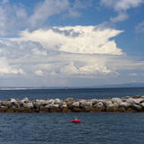 Breakwater with clouds