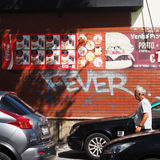 Man with graffiti wall