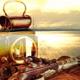 Lamp with flintlock on a shiny sea