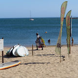 Man on beach with towels, Cascais