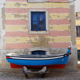 Blue and red boat with stripes