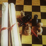 Chess pieces and manuscript