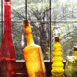 Coloured bottles with tree