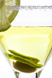 Green olive and lemon in frosted glass