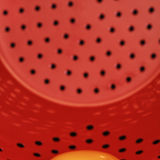 Egg yolk in red colander