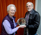 Peggy presents the Maggie Imhoff Trophy to Malcolm for "Love Will Remain"