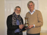 Malcolm receiving the Caroline Trophy