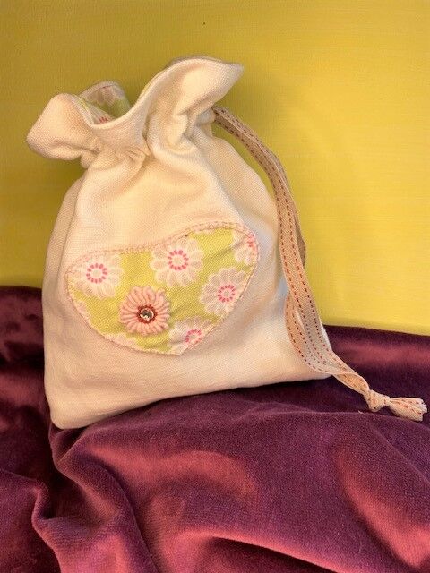 Embellished heart drawstring bag